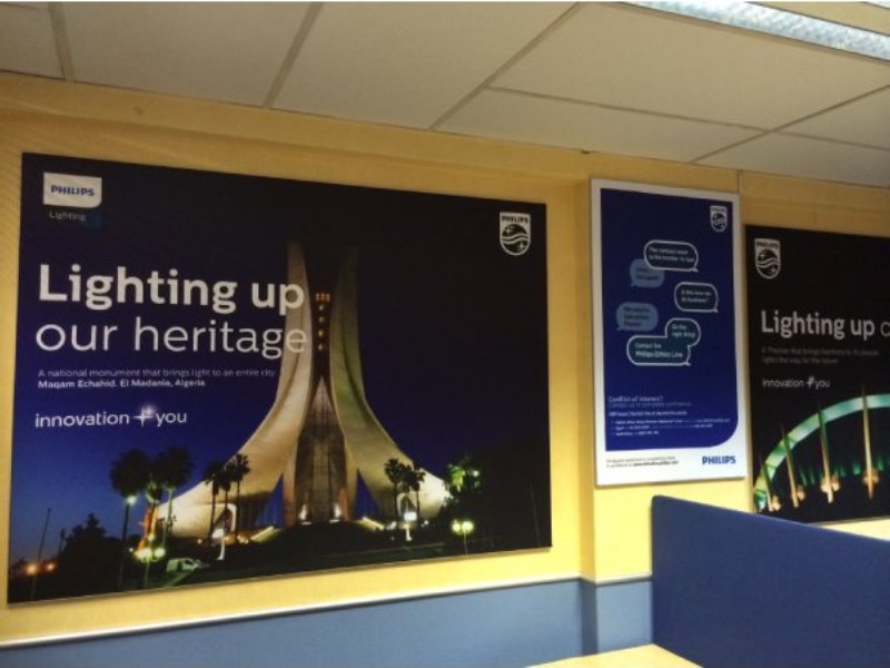Wall-mounted fabric wall frame with seamless SEG graphics for interior branding.
