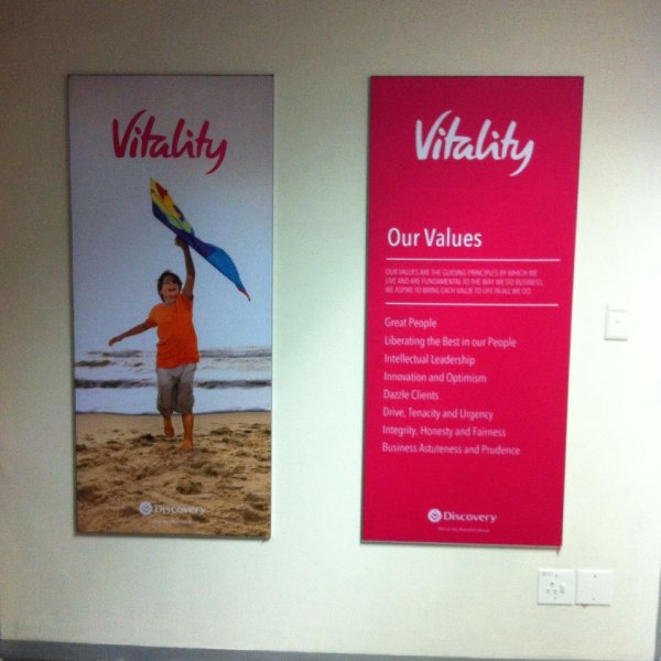 Wall-mounted fabric wall frame with seamless SEG graphics for interior branding.
